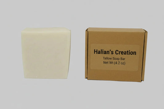 Beige bar of soap on a white background